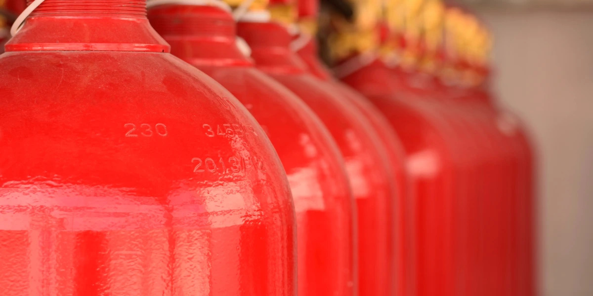 A row of carbon dioxide extinguishers in a petrochemical plant